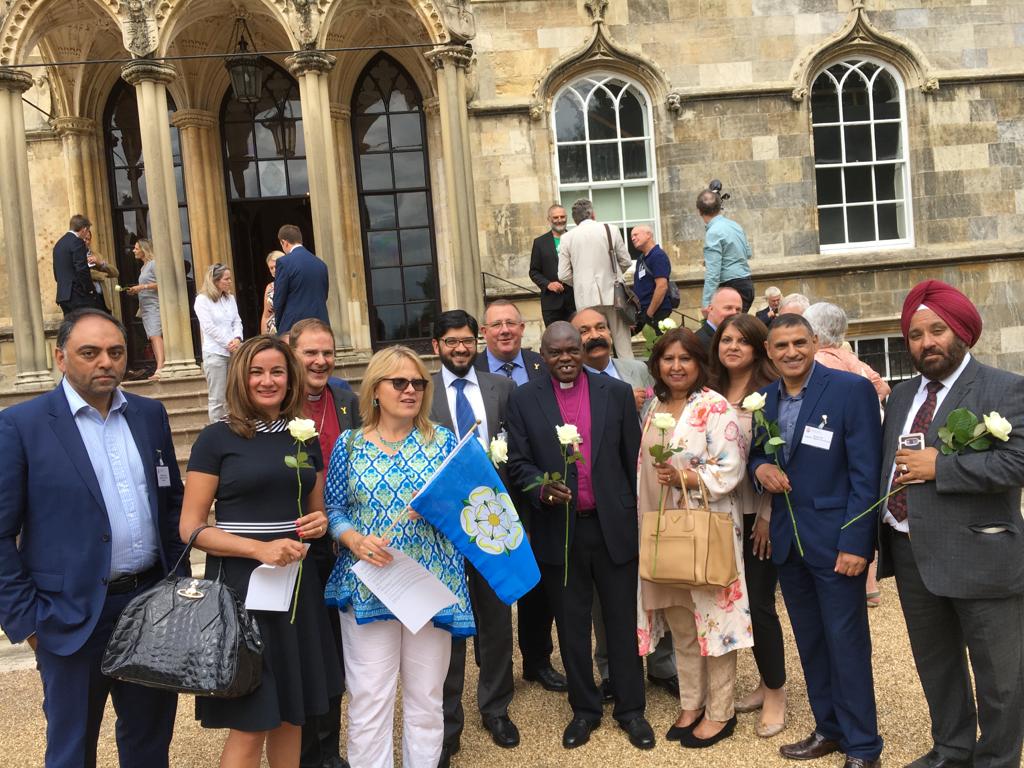 Kersten England with community leaders in Bradford