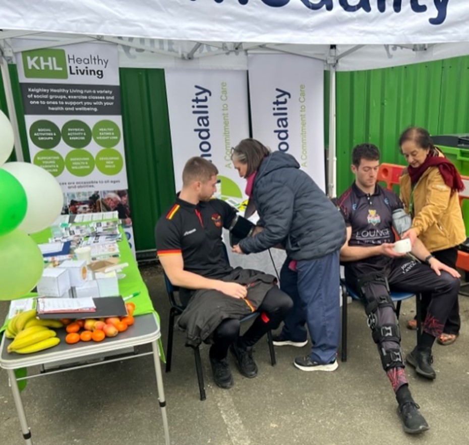 Bradford Bulls and Keighley Cougars players getting their blood pressure checked
