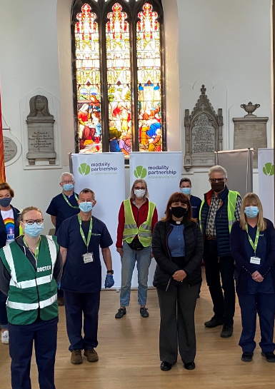 People wearing masks in church